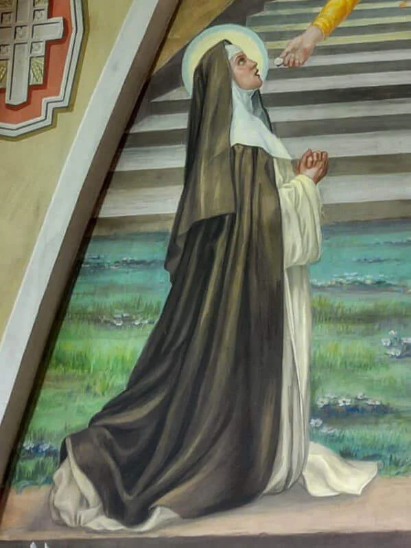 Detalle de la figura de santa Amelia en oración